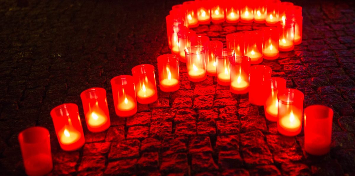 Candles form a red ribbon in Berlin, on November 30, 2013 during the World Aids Day. AFP Photo /DPA / Florian Schuh/ GERMANY OUT